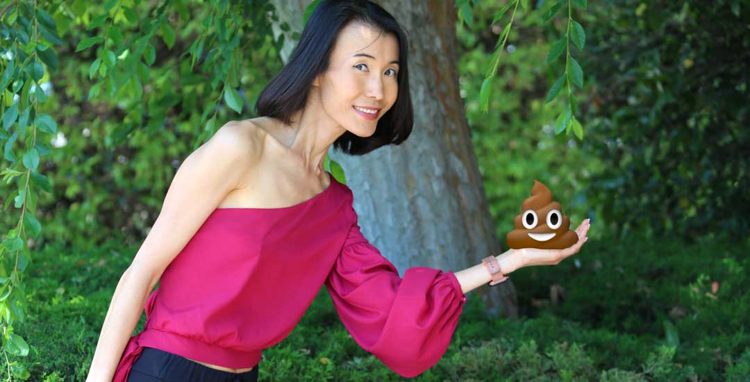 Jing Ge holding Poop emoji