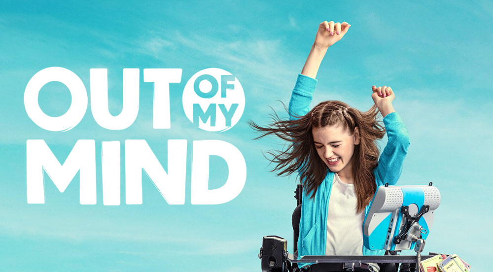 Movie poster for out of my mind movie with young girl in wheelchair smiling with arms in the air in celebration