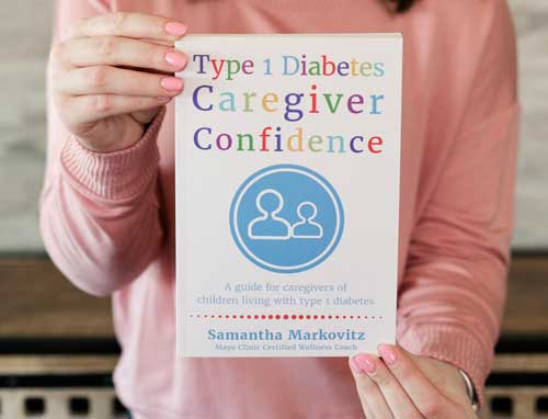 Woman holding book titled Type 1 diabetes caregiver confidence