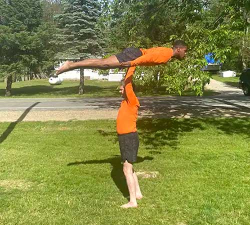ray holds daseph flat over his head